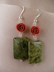 Red roses above serpentine jade rectangles