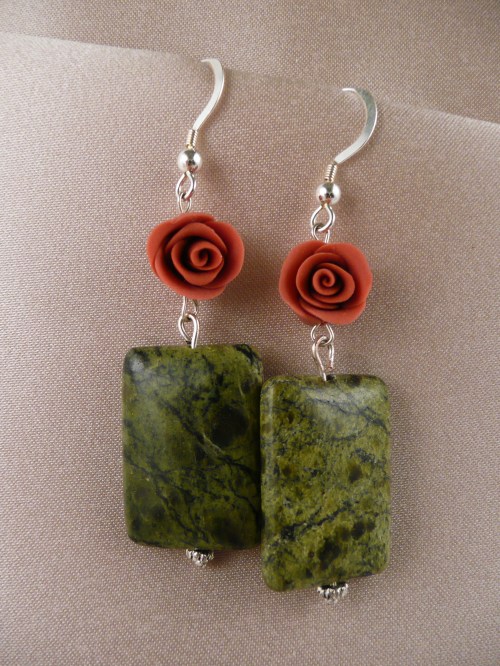 Red roses above serpentine jade rectangles
