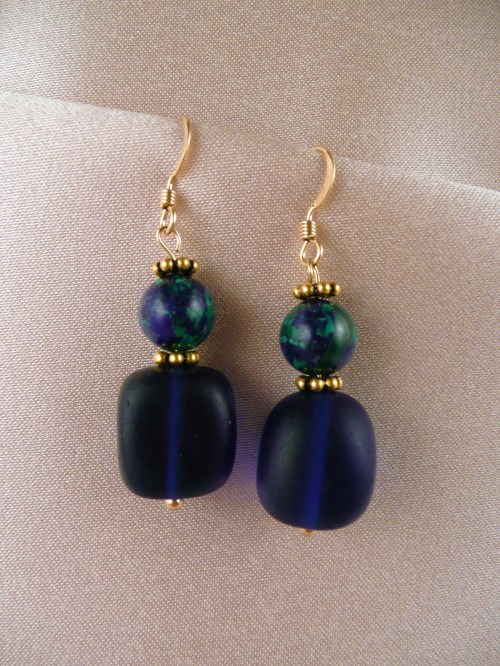 Globes of mixed azurite and malachite above deep blue 'sea glass'