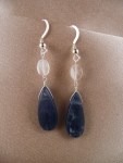 Teardrops of kyanite hang from oval moonstones